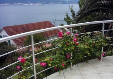 Scenic 3-story home in Krasici with sea view and palm